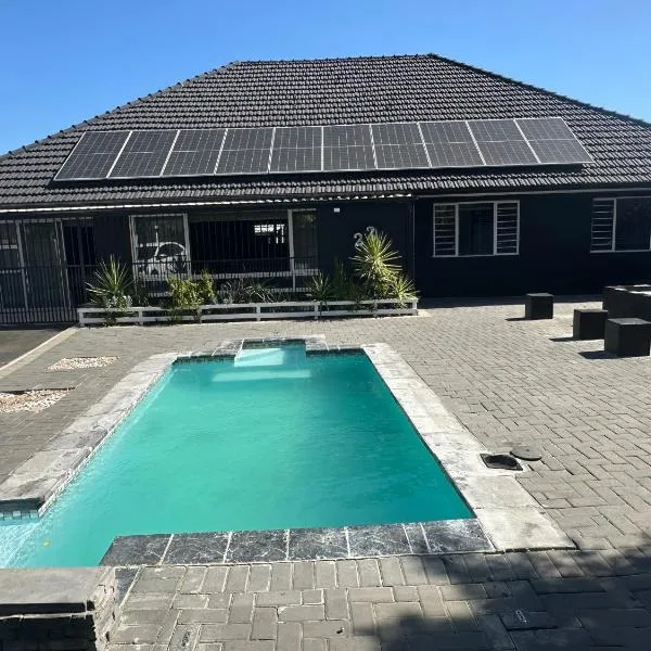 Bell rose oaks guest house, hotel a Blomtuin