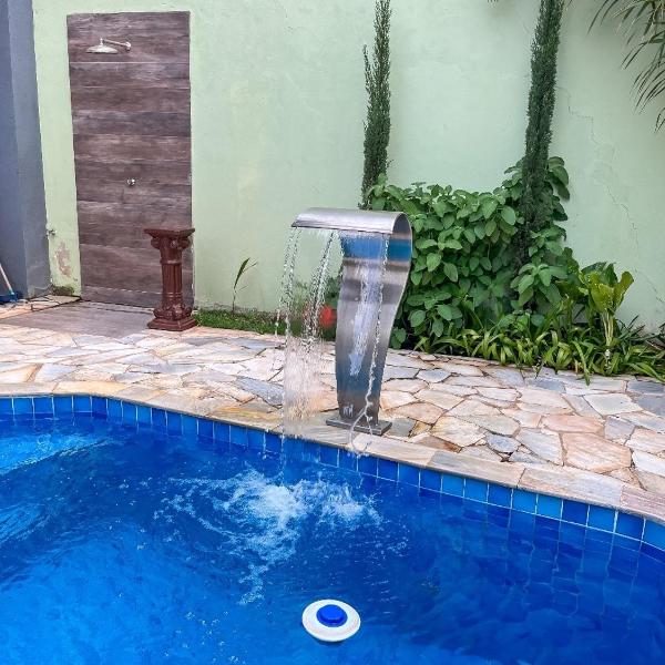 Casa com piscina e cascata e spa fogão a lenha