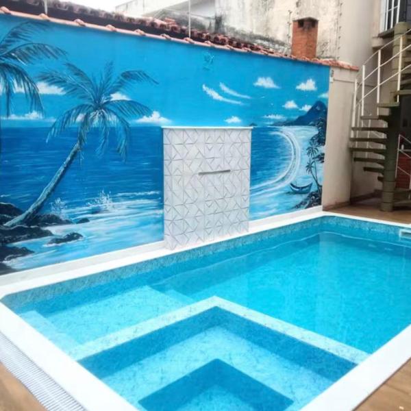 Casa com piscina ao lado da praia