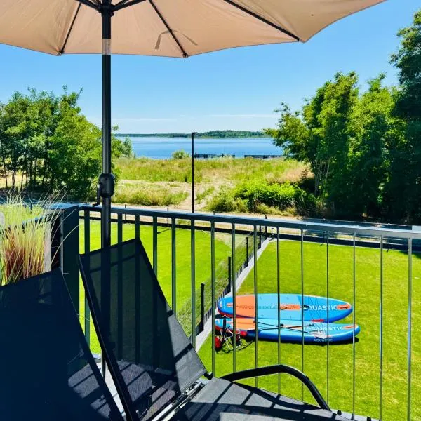 8 Personen Ferienhaus ,,Seegelblick" am Goitzschesee, erste Reihe am Strand mit Sauna, Whirlpool, Kamin, Wallbox & SUP, viešbutis mieste Pouch