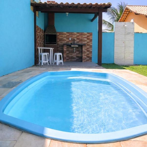 Casa do lado da praia com piscina, churrasqueira e ar condicionado