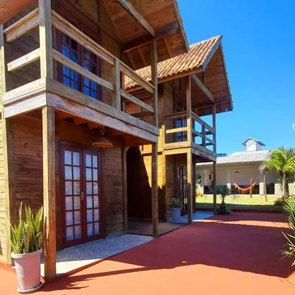 프라이아 두 로사에 위치한 호텔 Hospedaria Chalés Rota Do Sol PDR - Chalés para grupos na regiao central da Praia do Rosa SC