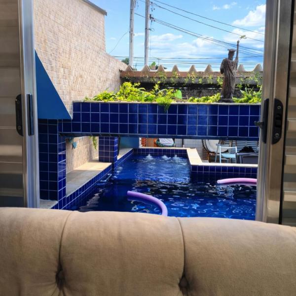 Casa com piscina na praia grande para temporada ou festas