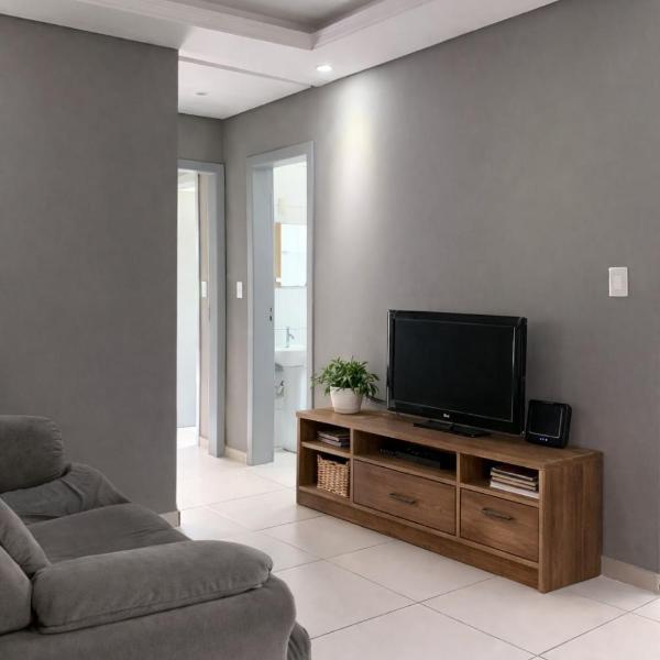 Amplo apartamento com suíte e ar condicionado