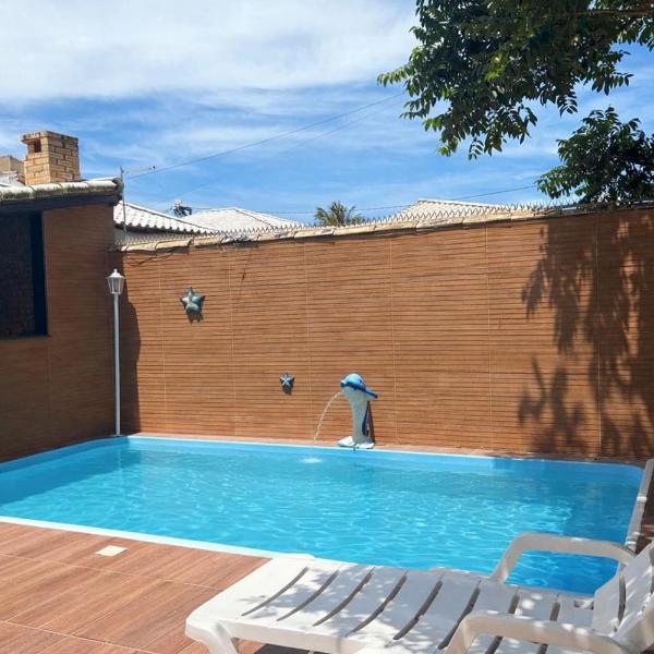 Casa de praia veraneio com piscina e área de jogos