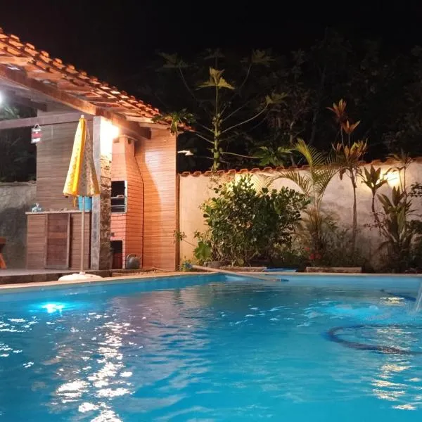 Casa em poucos passos da praia de Jaconé, хотел в Марика