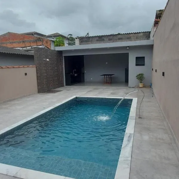 Casa 3 dormitorios a 3 km praia do indaia, hotel in Caraguatatuba