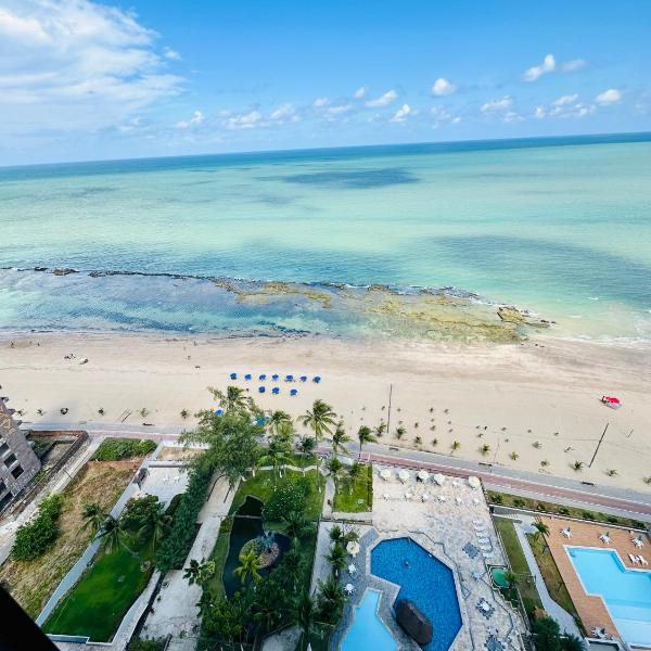 Flat pe na areia frente mar