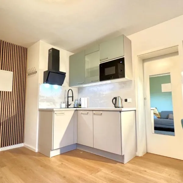 Sonnige, ruhige Gartenwohnung mit Terrasse u. Garten, hotel sa Oberhaching