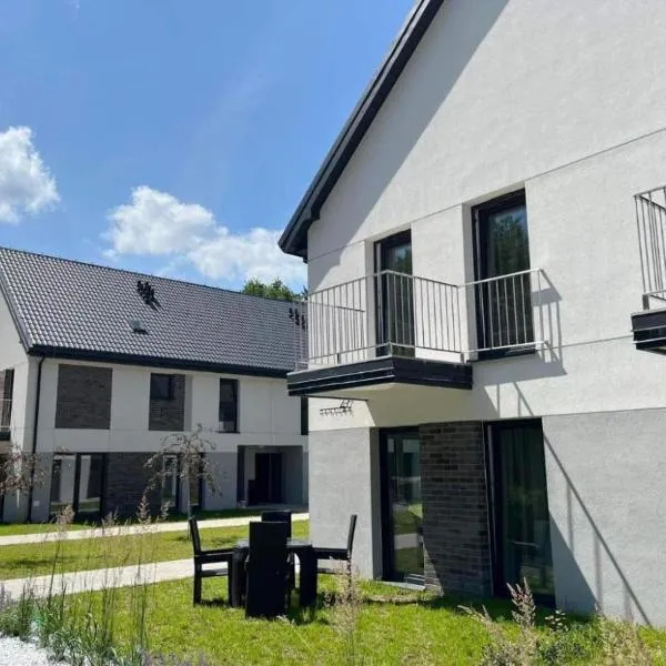 Sam Las Apartamenty Białowieża، فندق في بياوفييجا