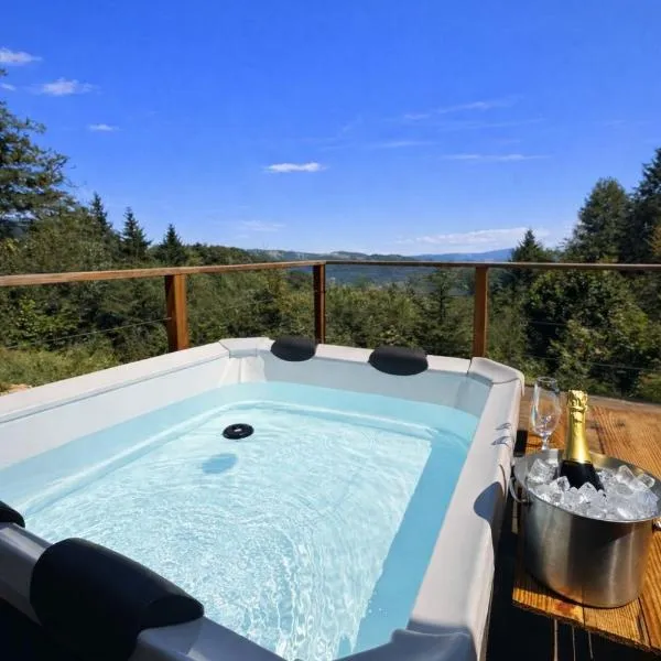 Chalet isolé avec jacuzzi et vue panoramique、Boncourtのホテル