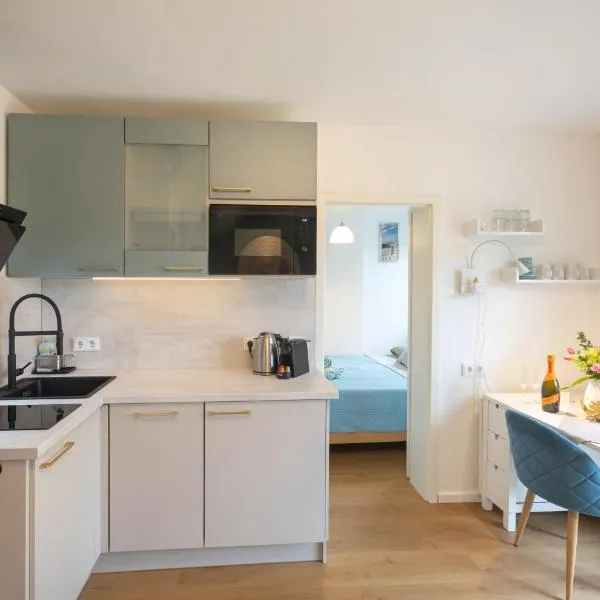 Sonnige, ruhige Gartenwohnung mit Terrasse u. Garten, hotel v mestu Oberhaching