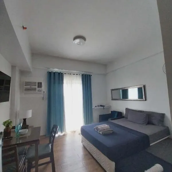 Family Suites at the Amani Grand Residences - Mactan Airport, hotel em Pusok