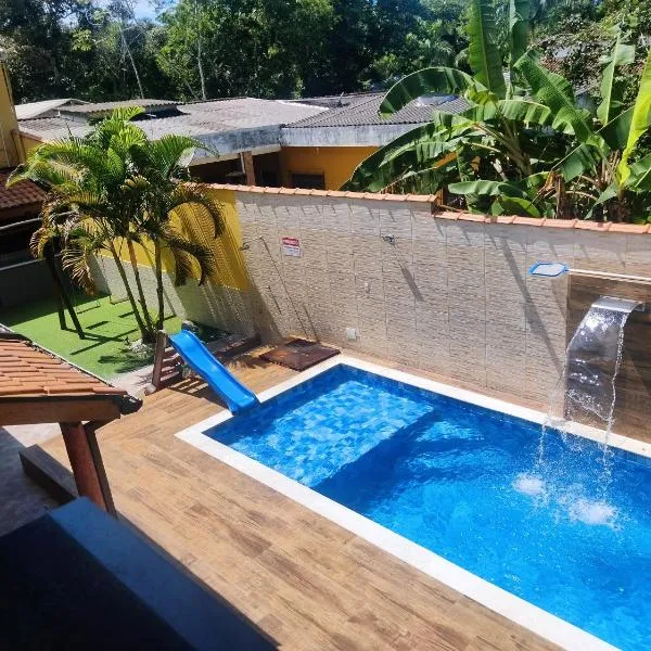 Casa com Jacuzzy aquecida e Piscina, próxima a praia ideal para famílias e casais, Hotel in Caraguatatuba