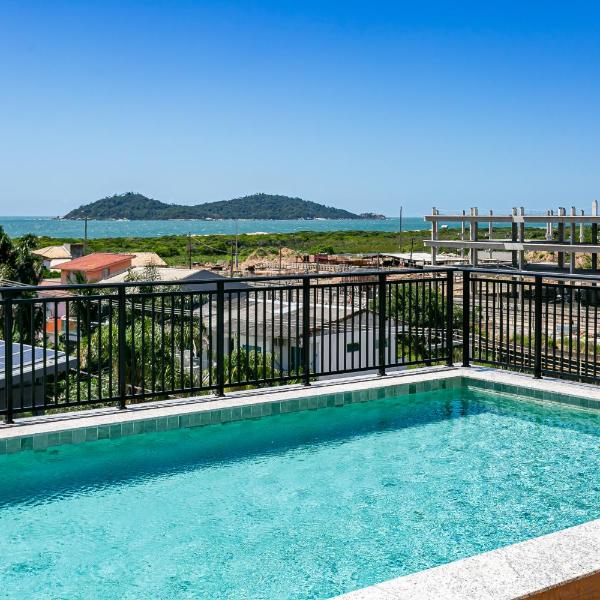 CORA Residence prédio a passos da praia, com piscina no terraço