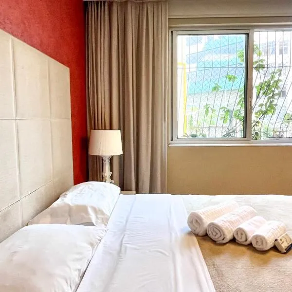 Quartos confortáveis e silenciosos em Botafogo - 5 min metrô com Ar Condicionado e Wi-Fi, Hotel in Rio de Janeiro