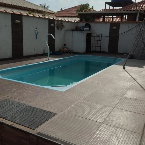 사콰레마에 위치한 호텔 Casa com piscina e área gourmet próximo à praia