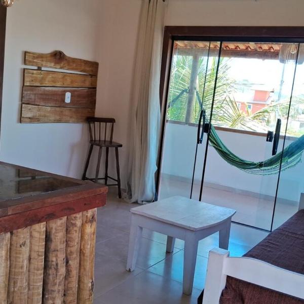 Rustic apartment with balcony and hammocks