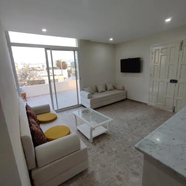 Appartement Les Oliviers avec piscine proche du lagon, hotell i Taguermess