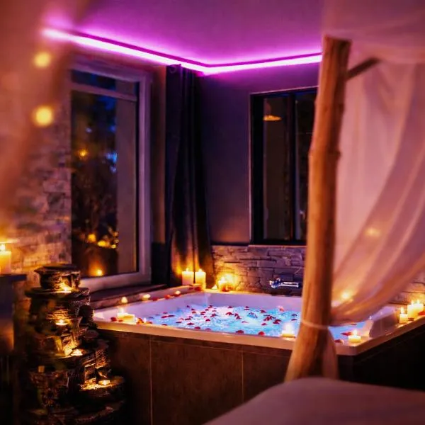 La suite Safari jusqu'à 4 personnes, Spa XXL, day use, 5 min centre ville, cinéma, cascade et lit sous les arbres, hotel en Bourgoin-Jallieu