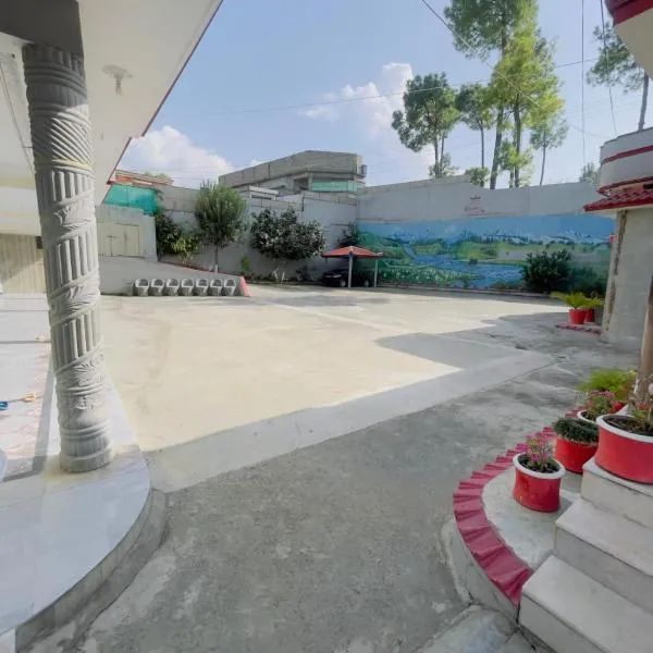 Roomy star resort، فندق في ابوت اباد