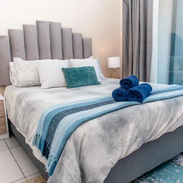 Luxury Ultra Modern Apartment - Queen Bed, Inverter, Pool, Gym & Spacious Balcony, Hotel in Ballito