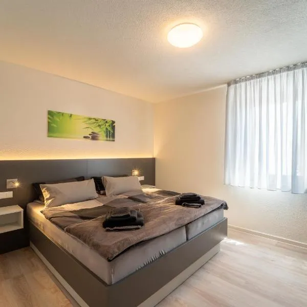 Aparthotel Neckartal - Premium Serviced Apartments mit je 2 Doppelzimmern - Highspeed-WLAN, 55'' Smart-TV in jedem Zimmer, Vollküche, Klima, Balkon, Parkplatz - 15 Min nach Stuttgart, Ludwigsburg & Waiblingen - die perfekte Basis für Business & Privat!, hotel a Remseck am Neckar