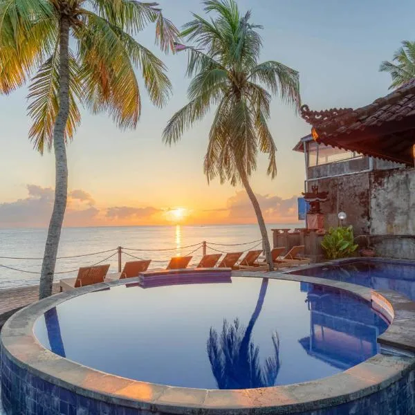 Paradise Palm Beach Bungalows and Dive Center, hotel in Tulamben