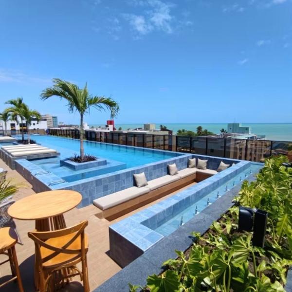 Flat 50m da praia com Piscina, academia, Até 3 pessoas