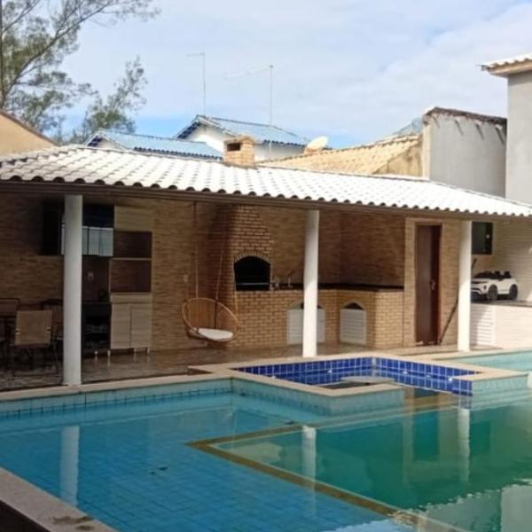 Casa pé na área com hidromassagem e piscina