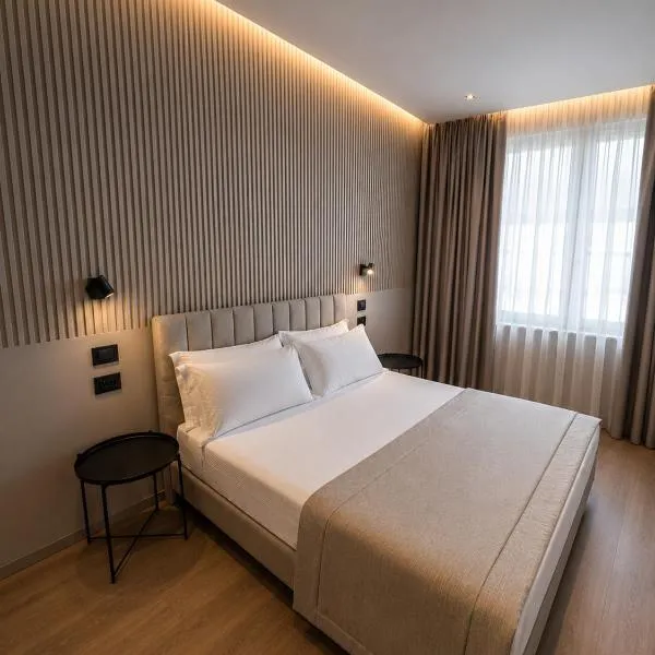 The Q House, hotel u gradu Folinjo