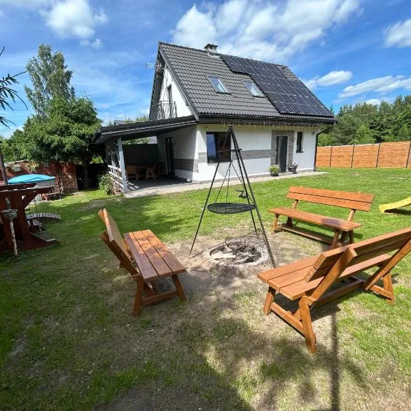 Mazury Dom Oskar nad jeziorem Sasek Wielki z jakuzzi, hotel em Szczytno