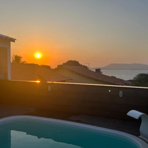 refúgio com piscina, hidro e vista para lagoa