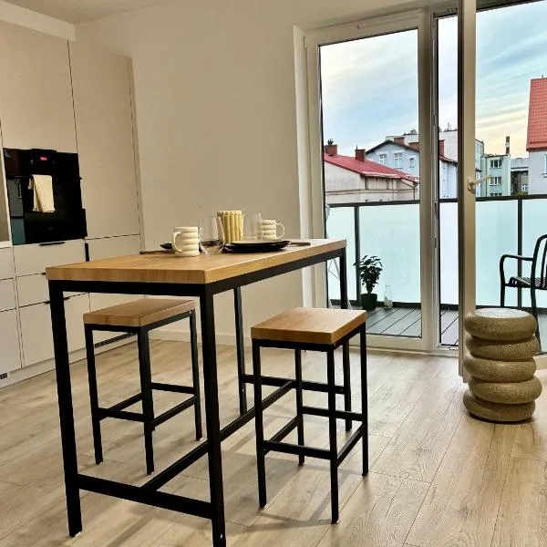 Nowo wybudowany Apartament w Centrum, Garaż Podziemny, Balkon, Winda, Wideodomofon, Wynajem na Doby, hotel v destinácii Białogard