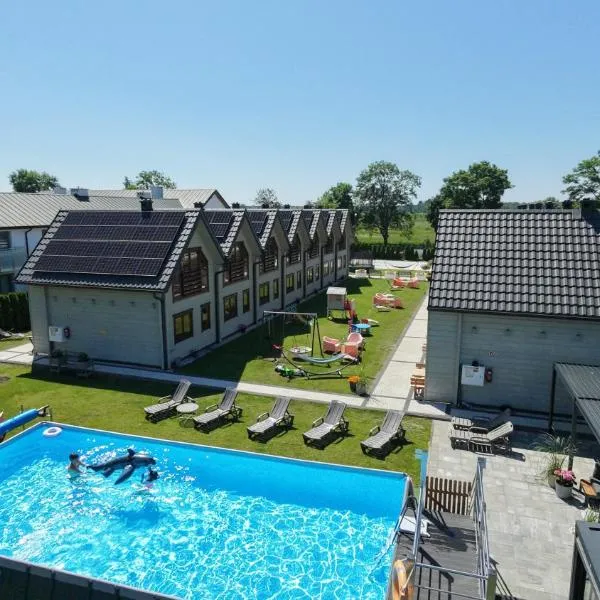 Domki Gala- blisko plaży, basen z podgrzewaną wodą , sauna , parking, hotel in Grzybowo