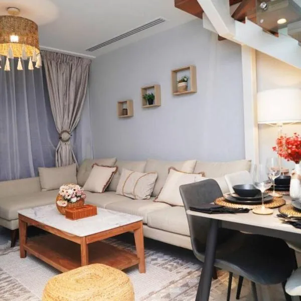 Elegant 2BR Jade Serenity - Chic Modern City Haven, Hotel in Al Qurayyah
