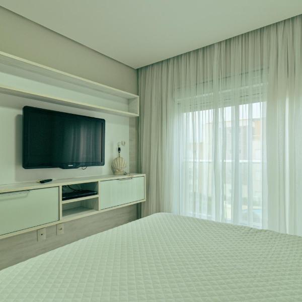 Apartment in Santinho Beach with private beach access