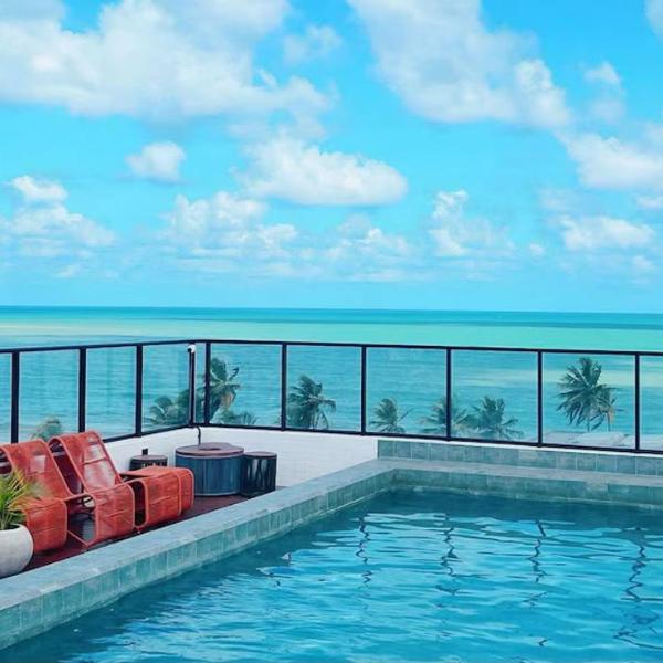 Apartamento com jacuzzi privativa e piscina com vista pro mar