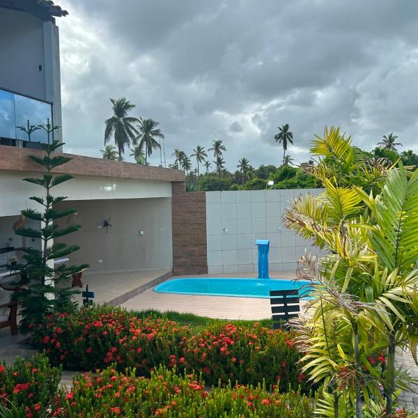 Casa com Piscina dentro do Condominio Mar de São José em Frente ao Restaurante Calamares