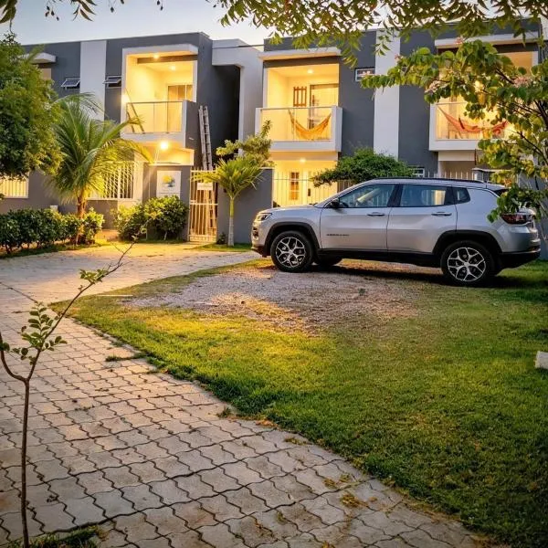 Paripueira में, होटल MSFlats Paripueira praia varanda c rede cozinha Wifi Ar split