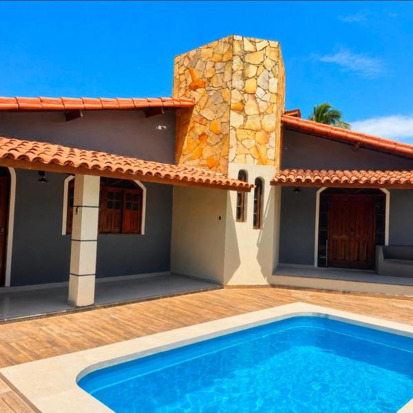 Casa de Praia com área verde e piscina