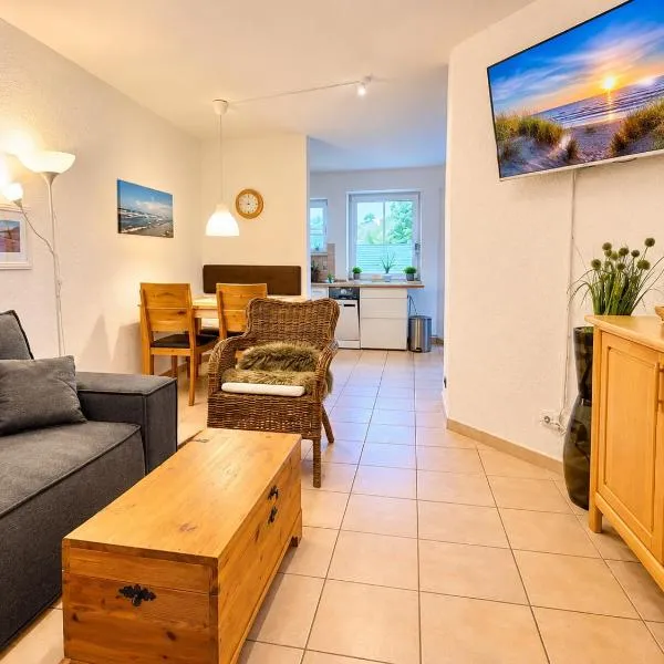 Ostsee-Familienapartment in Scharbeutz mit Pool & Spielzimmer – hotel w mieście Scharbeutz