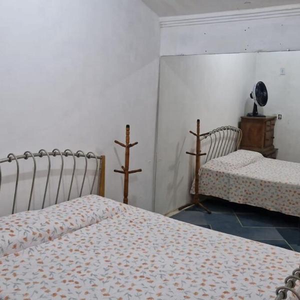 One bedroom for two people with a fan